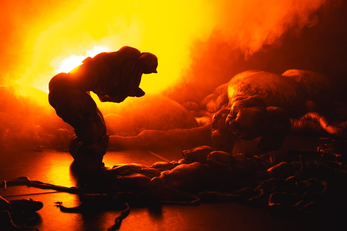 The contorted silhouette of a "Howler" against a fiery backlight. In the foreground, twisted roots evocative of Filipino fauna. In the background, rock-like orbs.